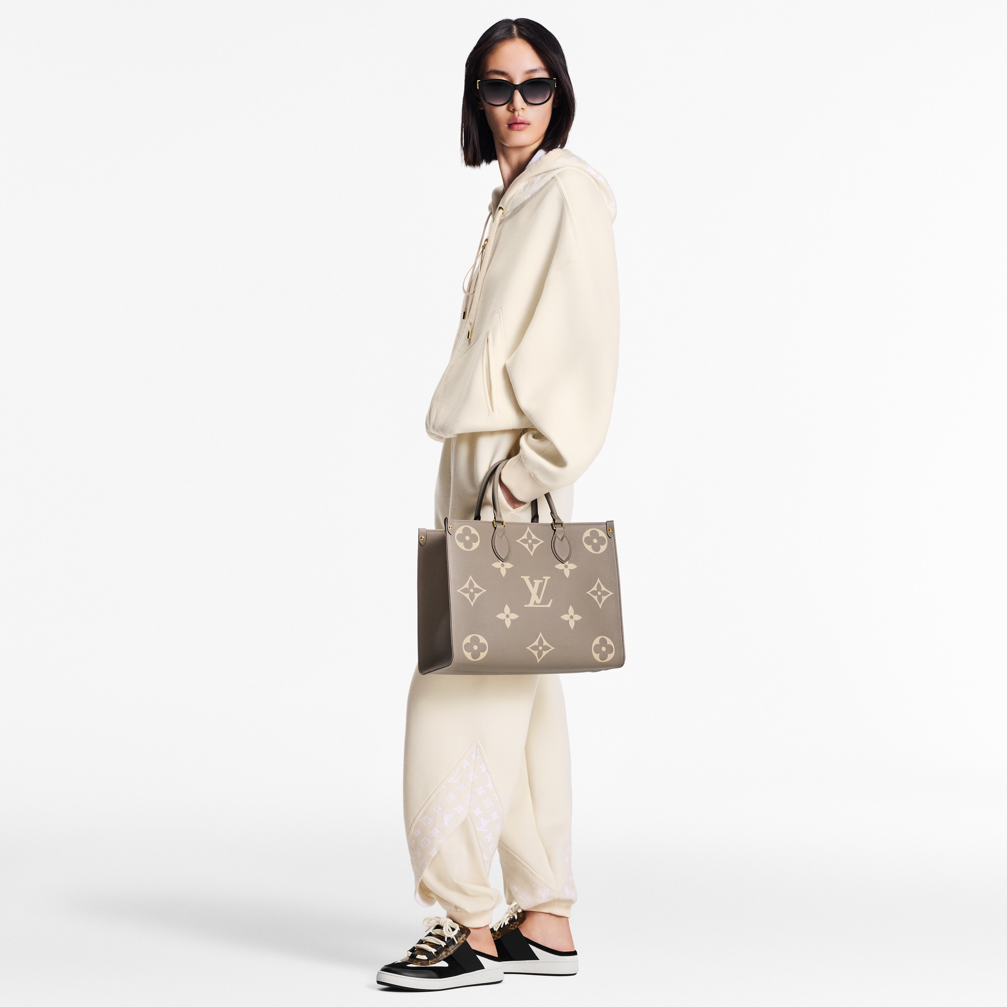 Onthego MM Bicolor Monogram Empreinte Leather in Women